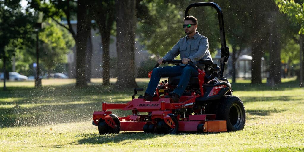 man riding his zero turn radius mower