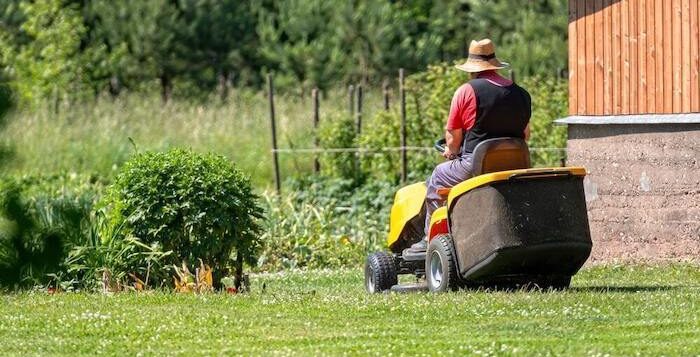 Skinny riding lawn mower